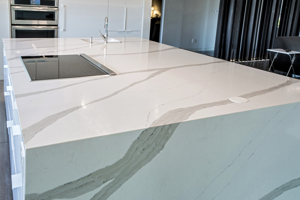 A quartz countertop with waterfall edges